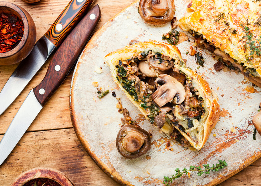 Tasty,Mushroom,Pie,Or,Wellington,Mushroom,On,Old,Wooden,Table.english